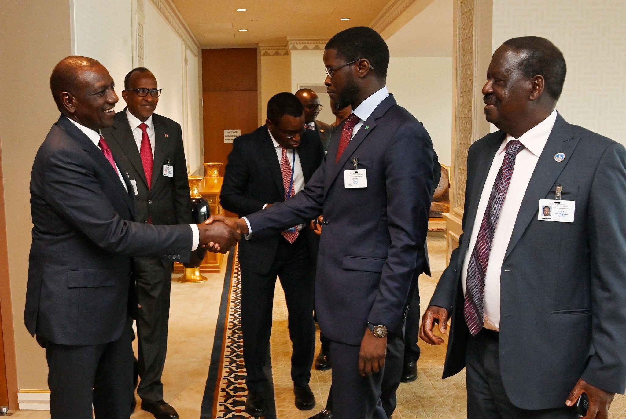 President William Ruto shakes hands with Senegalese president Bassirou Diomaye Faye as former Prime Minister Raila Odinga and Environment CS Aden Duale look on. PHOTO/@WilliamsRuto/X