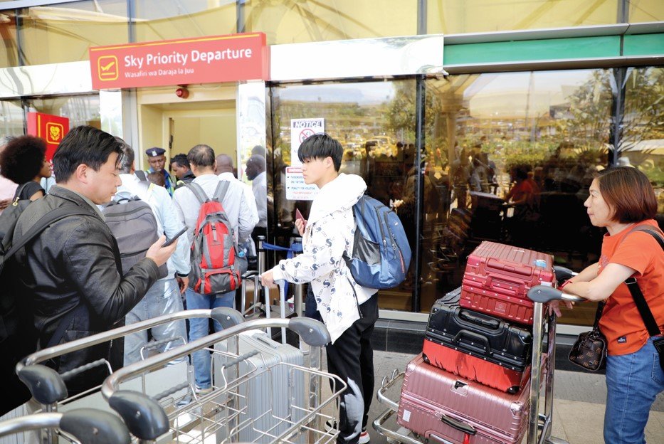 Stranded passengers at JKIA in Nairobi on September 11, 2024 after airport workers downed tools to protest a planned takeover of the airport by the Adani Group. PHOTO/BERNARD MALONZA