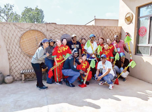 Journalists pose for a photo after visiting Zhenbeibu Western Film Studios as part of a four months training programme, which consists of visiting various parts of China. PHOTO/TRAVELOGUE CHINA