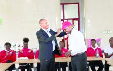 KPC volleyball club chairperson Paul Njuguna (L) welcomes the new head coach Geoffrey Omondi (R) during a welcoming ceremony held at KPC headquarters. PHOTO/Print