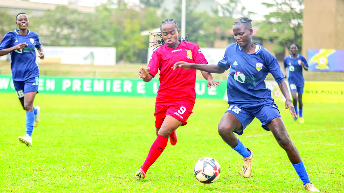 Rebecca Okwaro of Kenya Police (in red) vies for the ball against KISPED’s Sharlet Atieno during their season-opening match on Saturday.  PHOTO/ FKF