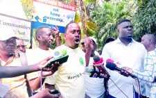 Haki Yetu executive director Peter Kiama speaks during the protests in Mombasa yesterday. PHOTO/Reuben Mwambingu