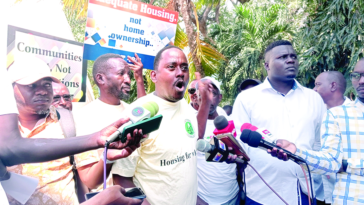 Haki Yetu executive director Peter Kiama speaks during the protests in Mombasa yesterday. PHOTO/Reuben Mwambingu