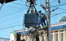 Kenya Power worker working on a transformer. PHOTO/Print