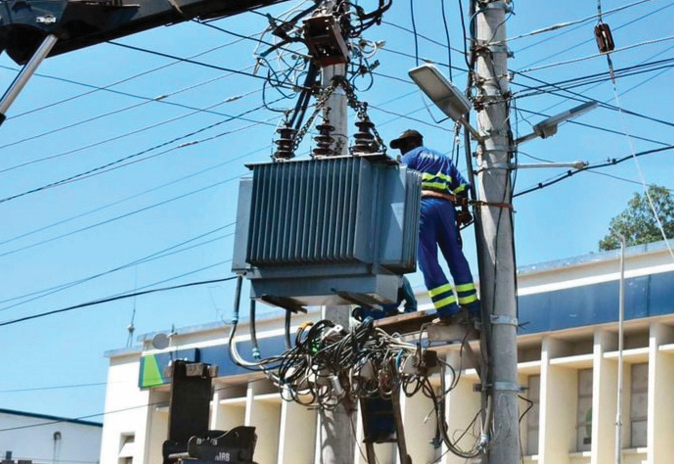 Kenya Power worker working on a transformer. PHOTO/Print