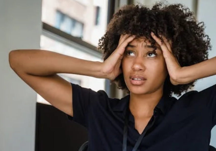 A woman looking stressed at the office. Image used for illustration purposes. PHOTO/Pexels