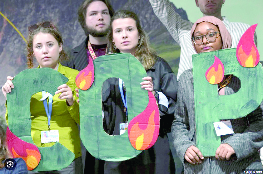 Activists take part in a demonstration against fossil fuels at the COP29 UN Climate Summit, on Friday.PHOTO/Print