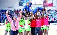 Team Kenya netball team tossing their coach Ali Mugisha in the air after their Mirxes Nations Cup victory. PHOTO/Print