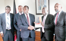 CS Wycliffe Oparanya receives audit report. PHOTO/Print