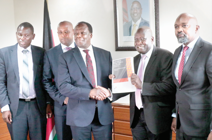 CS Wycliffe Oparanya receives audit report. PHOTO/Print