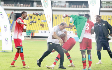 Harambee Stars players celebrate with Head Coach Engin Firat (left) after they won a regional tournament last year. PHOTO/Print