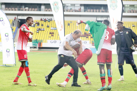 Harambee Stars players celebrate with Head Coach Engin Firat (left) after they won a regional tournament last year. PHOTO/Print