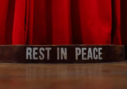 A red curtain with the words Rest in peace. Image used for representation only. PHOTO/Pexels