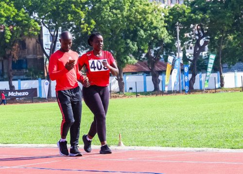 Senator Crystal Asige participates in the women's walking race with a guide. PHOTO/https://web.facebook.com/ParliamentKE