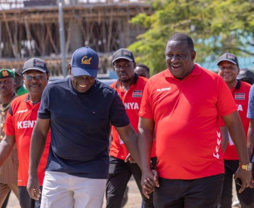 Former Trade CS Salim Mvurya (right) holds hands with President William Ruto during a past sports event in Mombasa. PHOTO/@Waziri_Mvurya/X