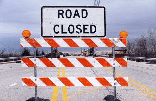 A caution sign in the middle of a road. Image used for representation only. PHOTO/Pexels
