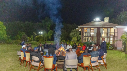 Right (standing) Farouk Kibet welcomes leaders to a night meeting at his home in Uasin Gishu. PHOTO/@HonOscarSudi/X