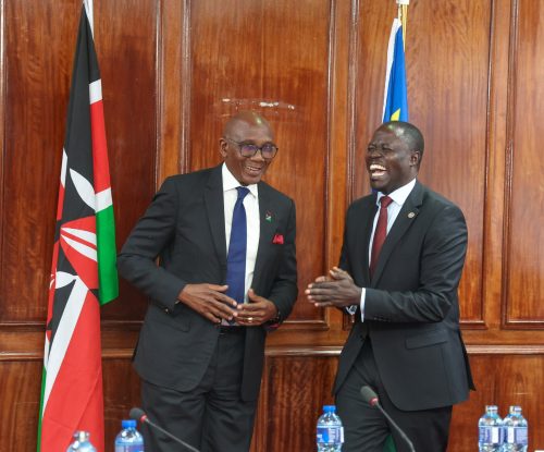 Secretary to the Cabinet of the Republic of Namibia, George Simataa shares a light moment with Homa Bay Township MP Opondo Kaluma. PHOTO/@NAssemblyKE/X