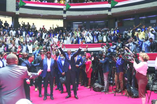 Rapid Support Forces (RSF) deputy commander Major Gen Abdul Rahim Hamdan Dagalo (right) with Sudan People’s Liberation Movement North leader Abdel Aziz Al -Hilu (left) upon arrival at KICC in Nairobi on Tuesday. PHOTO/Print