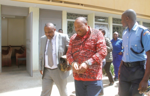 Former Kiambu Governor Ferdinard Waititu is escorted to police cells accompanied by his lawyer John Swaka. Waititu faced for various charges related to money laundering and corruption. PHOTO/Charles Mathai