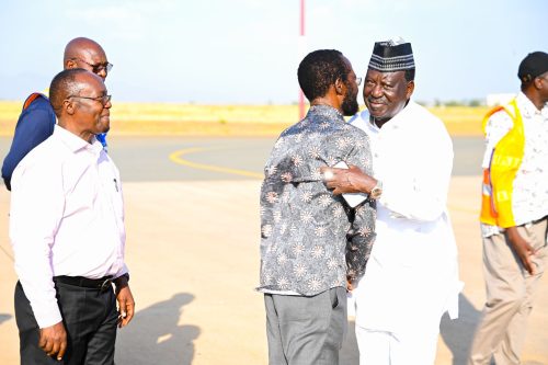 Governor Anyang Nyongo receiving Raila Odinga at Kisumu International Airport.