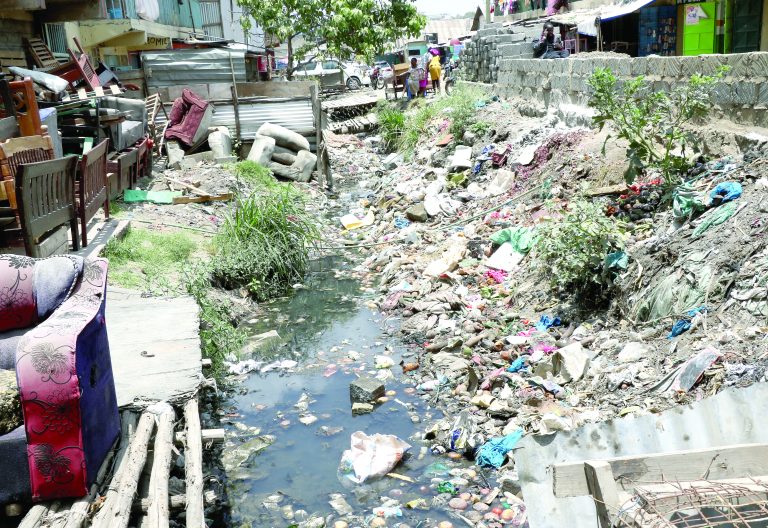 A stream in Tassia estate in Embakasi East constituency, Nairobi, choking with household waste. Residents dump their rubbish in streams like this one instead of areas designated by the county. PHOTO/Kenna Claude