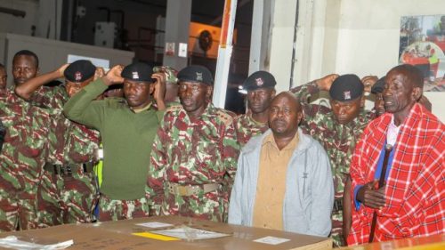 Police officers and family members of the late Samuel Kaetuai receive his body from Haiti at the JKIA on March 10, 2025. PHOTO/@NPSOfficial_KE/X
