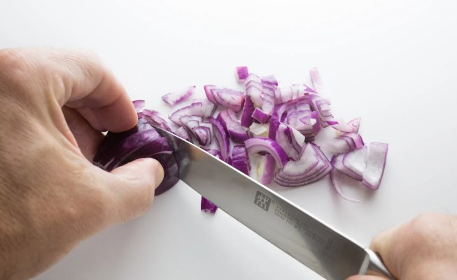 Person\'s Chopping Onion. Image used for representation purposes. PHOTO/Pexels