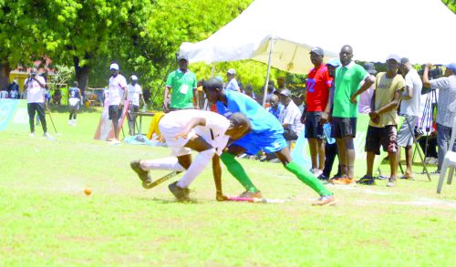 St Anthony High School (in white) battles it out with Mike Thande of Hospital Hill High School