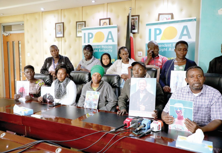 Family members of people killed during anti-government protests last year hold portraits of their departed relatives when they visited Independent Policing Oversight Authority offices in Nairobi on July 31, 2024. PHOTO/Bernard Malonza