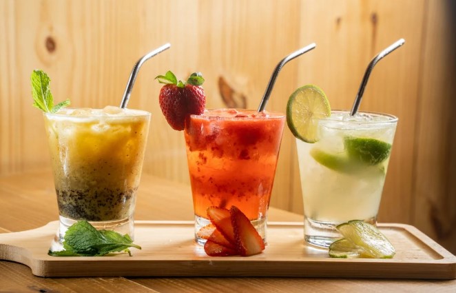Three different drinks on a wooden tray with straws.Image used for representational purposes only. PHOTO/Pexels