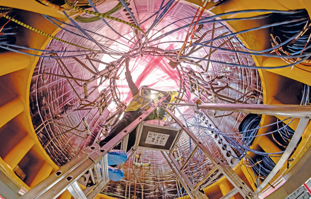 Installation of the first superconducting magnet, Poloidal Field Coil 6, in the Tokamak pit at the ITER construction site. The Central Solenoid will be mounted in the centre after the vacuum vessel has been assembled. ITER Organisation. PHOTO/Print