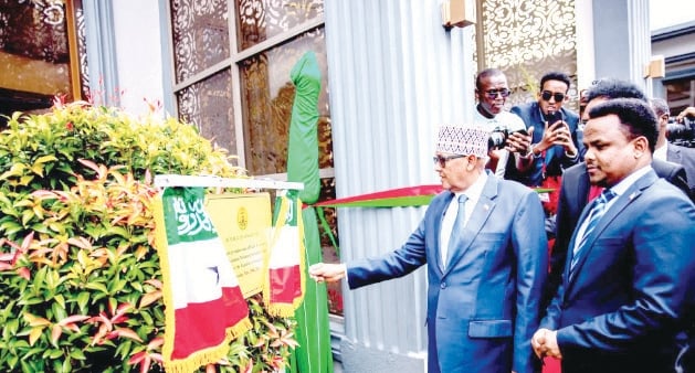 Somaliland President Abdirahman Mohamed Abdillahi (2nd left) joined by Somaliland Representative to Kenya Ambassador Dr. Mohamed Ahmed Mohamoud (left) cut the tape to unveiled their Mission premises in Kenya premises at Runda, Nairobi on May 29, 2025. PHOTO/Print