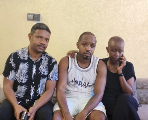 Boniface Mwangi with his wife and activist Khalid after being deported on Thursday, May 22, 2025. PHOTO/@husskhalid/X