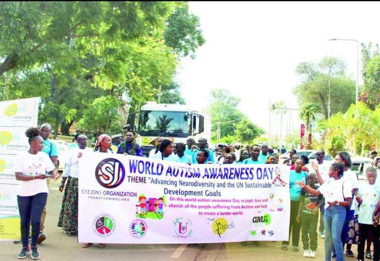 Members of the Kisii branch of the Association for the Physically Disabled of Kenya and caregivers of children with autism during a public sensitisation march through Kisii town in April. PHOTO/APDK