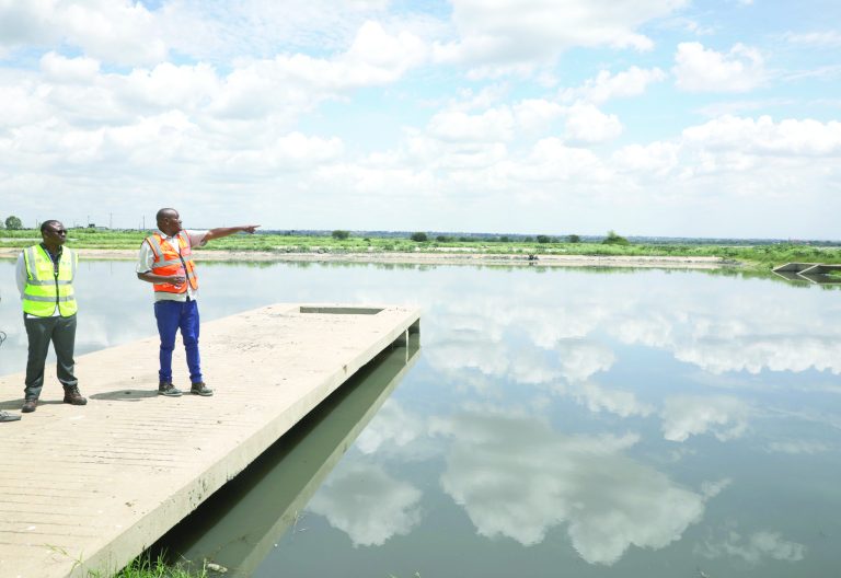 Deputy Director, Sewerage and Sanitation at Athi Water Works Development Agency (AWWDA) Engineer James Muturi (left) with Eng Duncan Kamau, the resident engineer, during a tour of the Dandora Estate waste water treatment plant in Ruai. PHOTO/Bernard Malonza