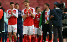 Arsenal beat Newcastle to seal Champions League spot