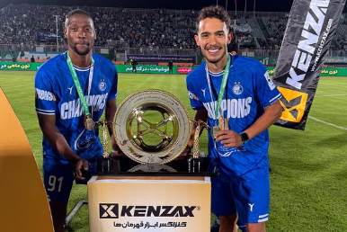 Masud Juma (L) and Hesam Eskandari with the trophy after winning the Hazfi Cup in Iran on Thursday, May 29, 2025. PHOTO/@masudjuma23/X