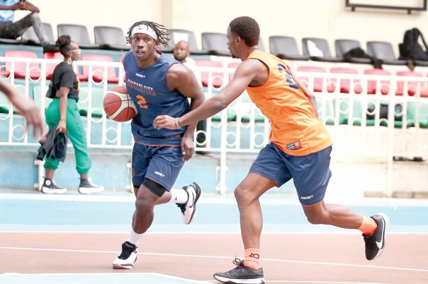 Thunder’s Derrick Ogechi (with ball) drives hard to the basket during one of their trainings at Nyayo National Stadium. PHOTO/NCT