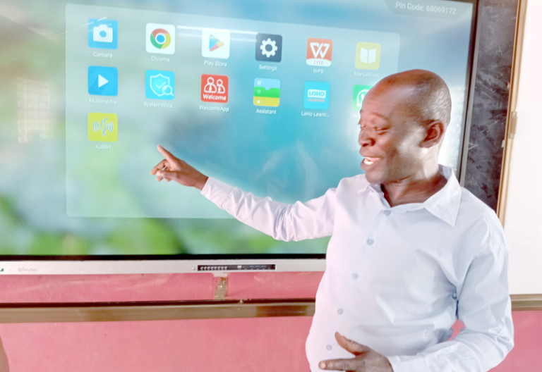 Gilbert Maitha, an ICT teacher at ACK St Andrews Tsangalaweni Child Development Centre, which has embraced digital learning, demonstrates how to use Smart Boards. PHOTO/Reuben Mwambingu
