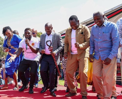 Deputy president Kithure Kindiki take a jig with area MPs and a local musician (left) at Kibirichia on Saturday, May 31, 2025. PHOTO/Dorcas Mbatia