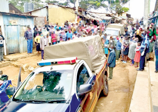 Police officers attend to a crime scene in Nairobi’s Huruma Estate after a reported incident. PHOTO/Charles Mathai