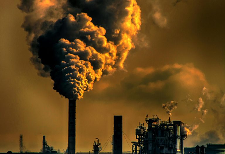 An industry with smoke billowing from one of its chimneys. Image used for illustration purposes. PHOTO/Pexels