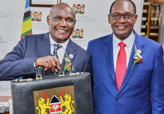 National Treasury CS John Mbadi Ng’ongo poses with the PS of the National Treasury Chris Kiptoo before heading to Parliament for the presentation of the 2025/2026. PHOTO/@KeTreasury/X
