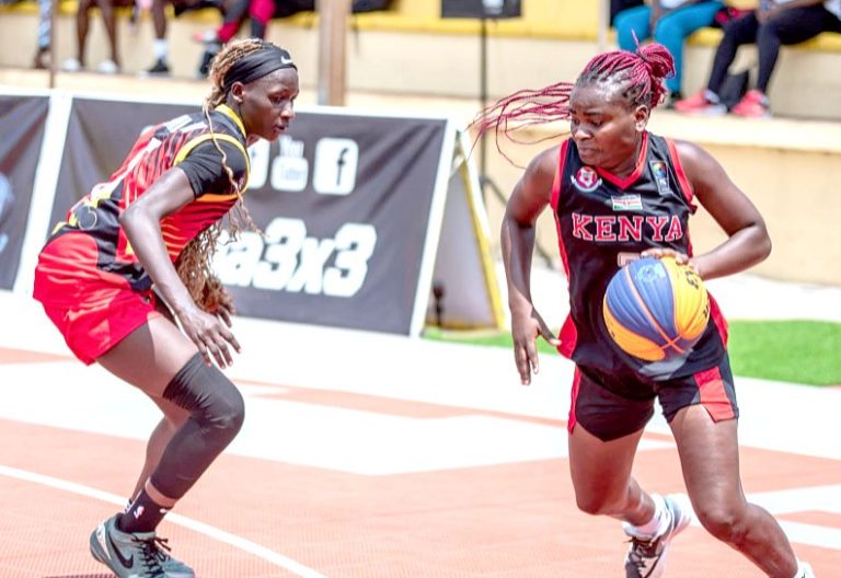 Kenya’s national women’s 3x3 basketball team player Everyone Diana Atieli (R) moves to dribble the ball past an opponent Uganda national team player. PHOTO/KBF