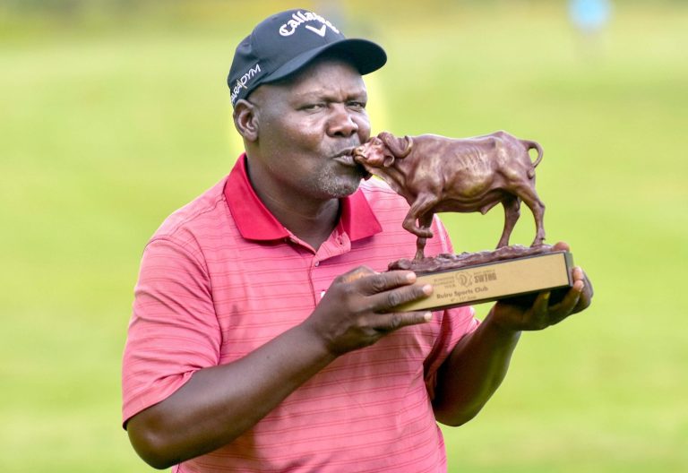 Dismas Indiza posed with the Sunshine Development Tour trophy after beating John Lejirma through a playoff at the Ruiru Sports Club. PHOTO/Alex Njue