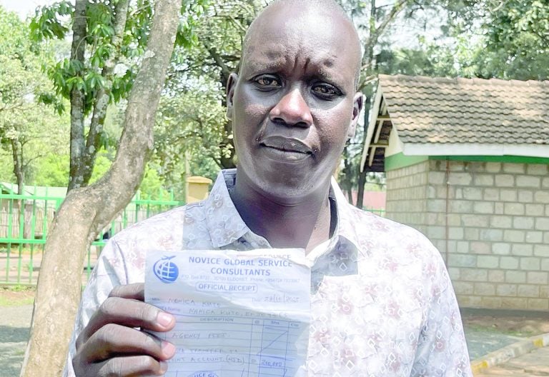 Julius Misoi, a victim of the job scam, displays the receipt bearing the name of an agency he claims to have paid Ksh750,000 to secure him a well-paying accountancy job in Canada, which never materialised one year down the line. PHOTO/Winstone Chiseremi