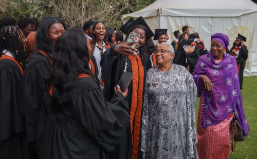 Graduates take selfies with the former First Lady Margaret Kenyatta during Brookhouse's 17th graduation ceremony at the Karen Campus on June 13, 2025. PHOTO/@4thPresidentKE/X