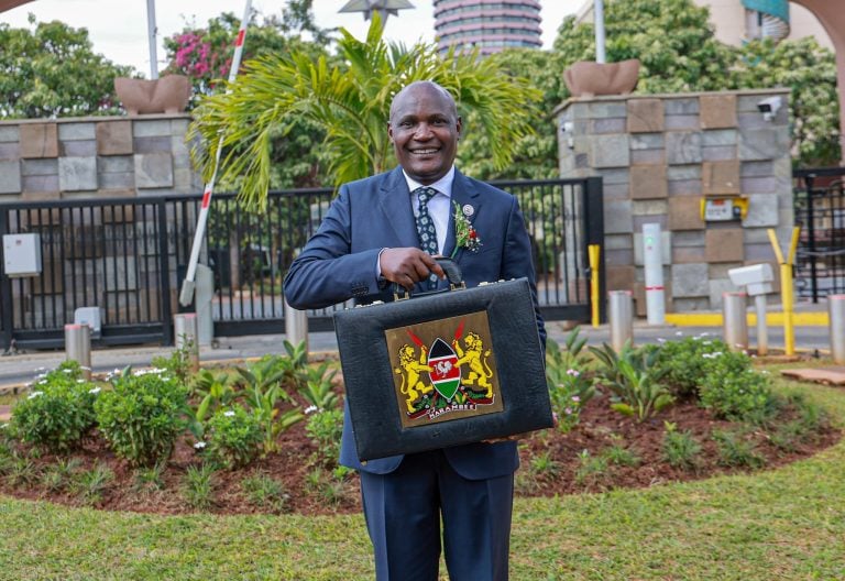 Treasury Cabinet Secretary John Mbadi holding buget briefcase. PHOTO/www.facebook.com/photo?fbid=1168757418625354&set=pcb.1168757788625317