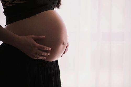 Pregnant woman holding her tummy. Image used for illustration purposes only. PHOTO/Pexels